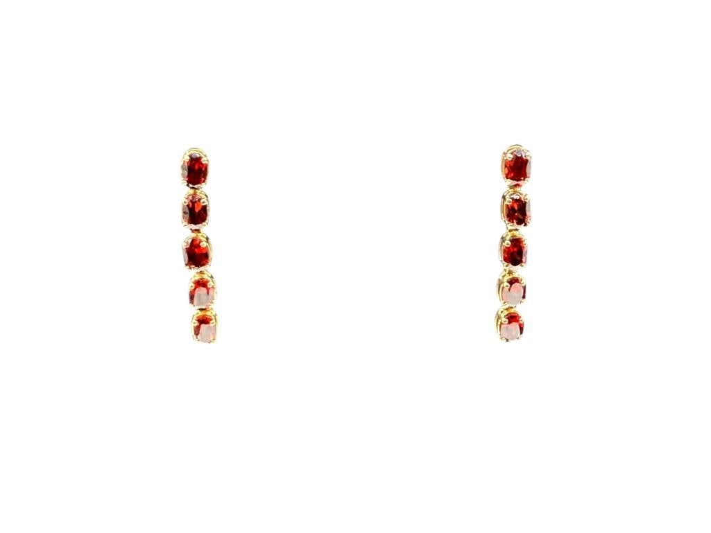 14K YELLOW GOLD OVAL CUT GARNET DANGLE EARRINGS: EACH EARRING FEATURES FIVE OVAL CUT GARNETS, BACKS ARE NOT GOLD 1 1/4", 2.66 GRAMS WITHOUT BACKS, 6MM X 4MM GARNETS