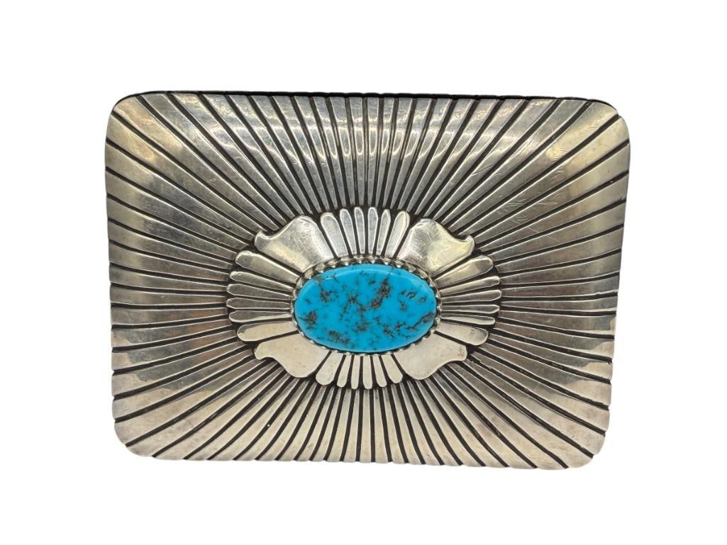 VINTAGE NAVAJO THOMAS SINGER ARTIST SIGNED STERLING SILVER TURQUOISE BELT BUCKLE: FEATURING AN OVAL SHAPED TURQUOISE IN CENTER OF SUNBURST PATTERN DESIGN, SIGNED BY ARTIST 4", 124.84 GRAMS, 1" TURQUOISE