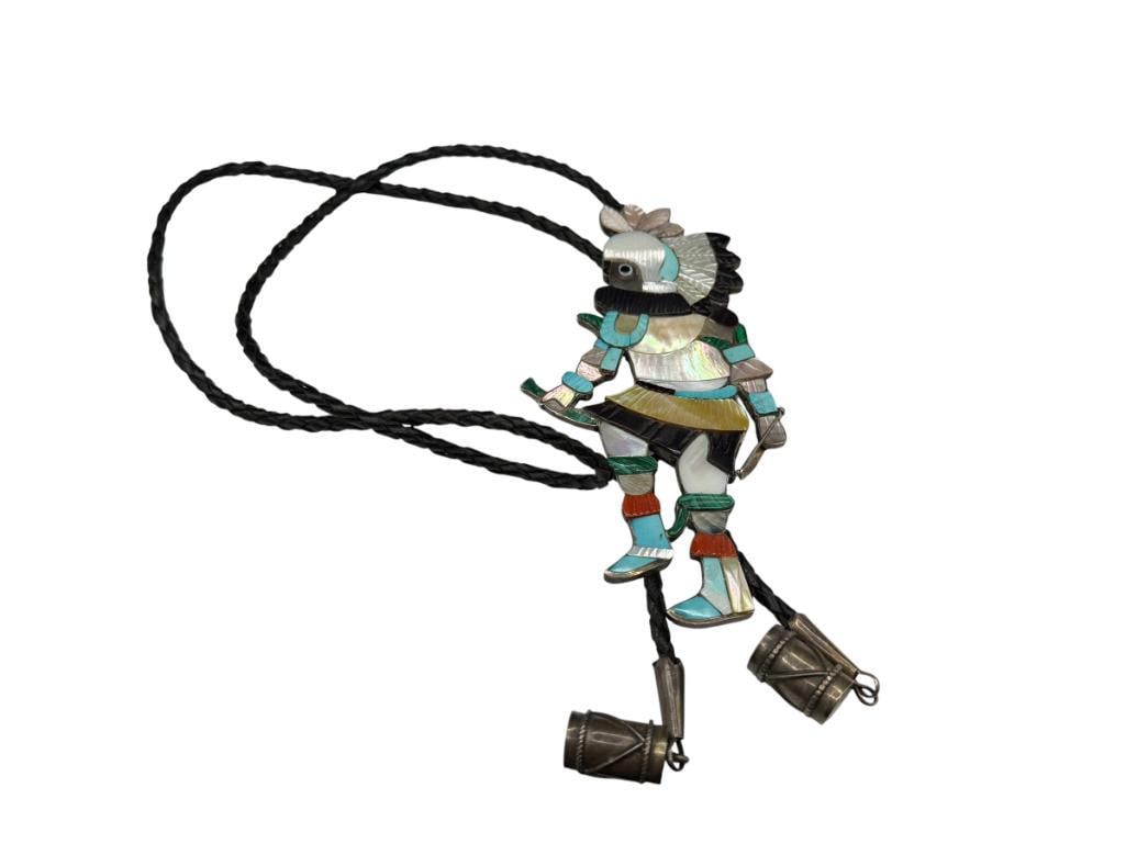 VINTAGE ZUNI EDDIE BEYUKA ARTIST SIGNED STERLING SILVER KACHINA BOLO TIE FEATURING TURQUOISE: KACHINA IS ACCENTED WITH TURQUOISE, CORAL, MALACHITE, MOTHER OF PEARL, AND ONYX, LEATHER BOLO TIE, INFO ON BACK OF BOLO KACHINA IS 5 1/4", APPROX. 70 GRAMS
