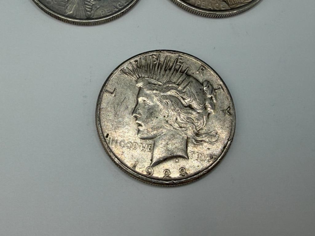 FIVE U.S. PEACE SILVER DOLLARS FEATURING VARIOUS DATES AND MINT MARKS - 6