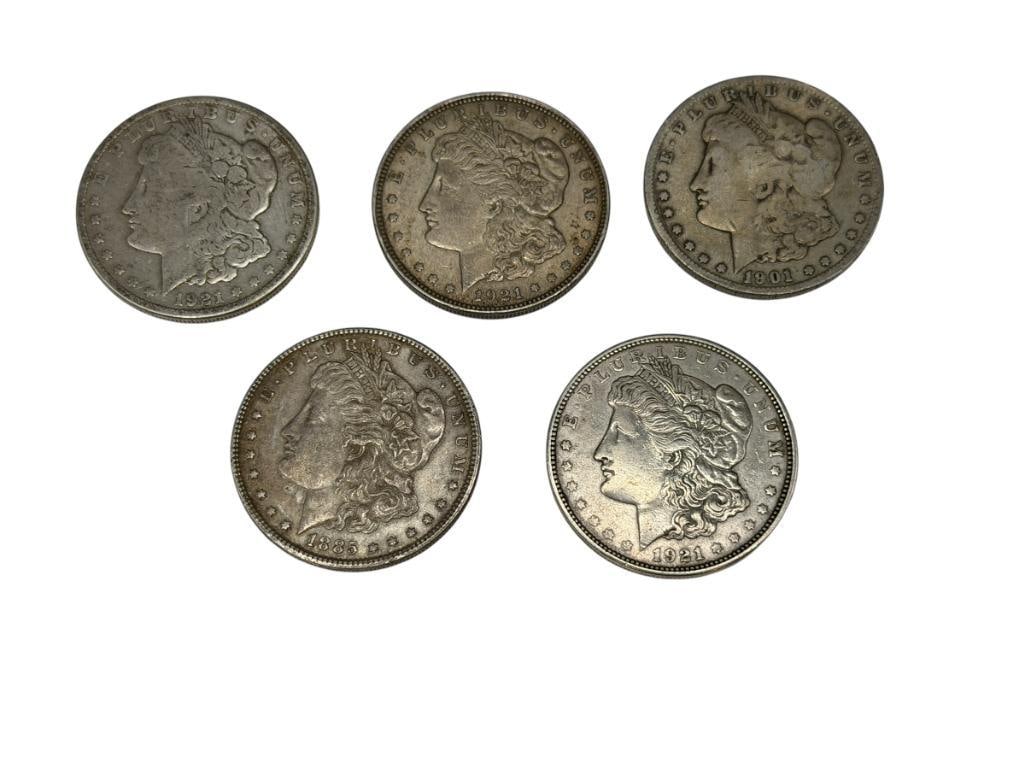 FIVE U.S. MORGAN SILVER DOLLARS FEATURING VARIOUS DATES AND MINT MARKS: INCLUDES 1885, 1901-O, 1921, 1921-S, AND 1921-D, 90% SILVER