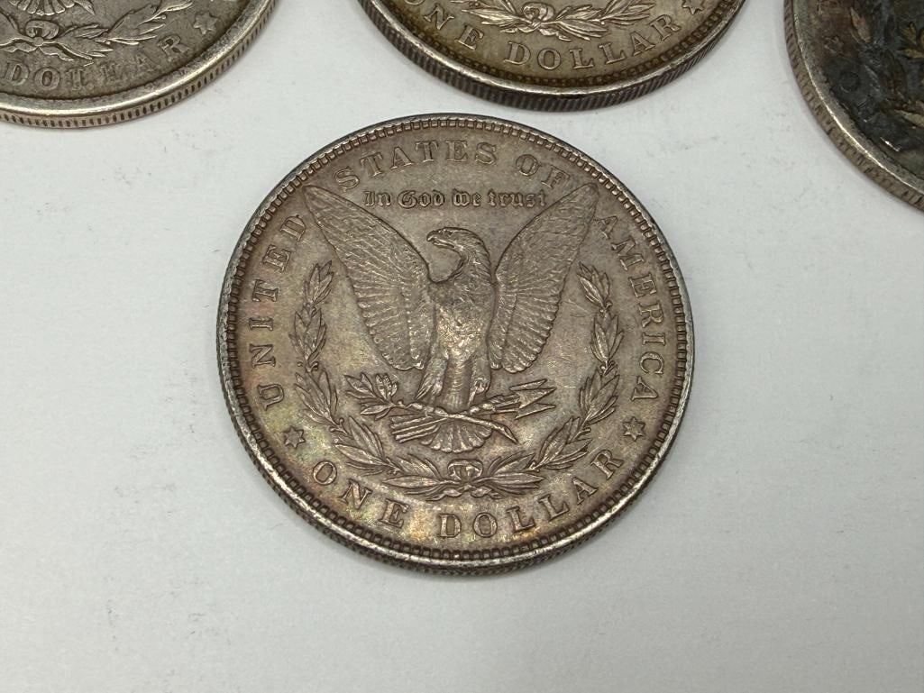 FIVE U.S. MORGAN SILVER DOLLARS FEATURING VARIOUS DATES AND MINT MARKS - 7