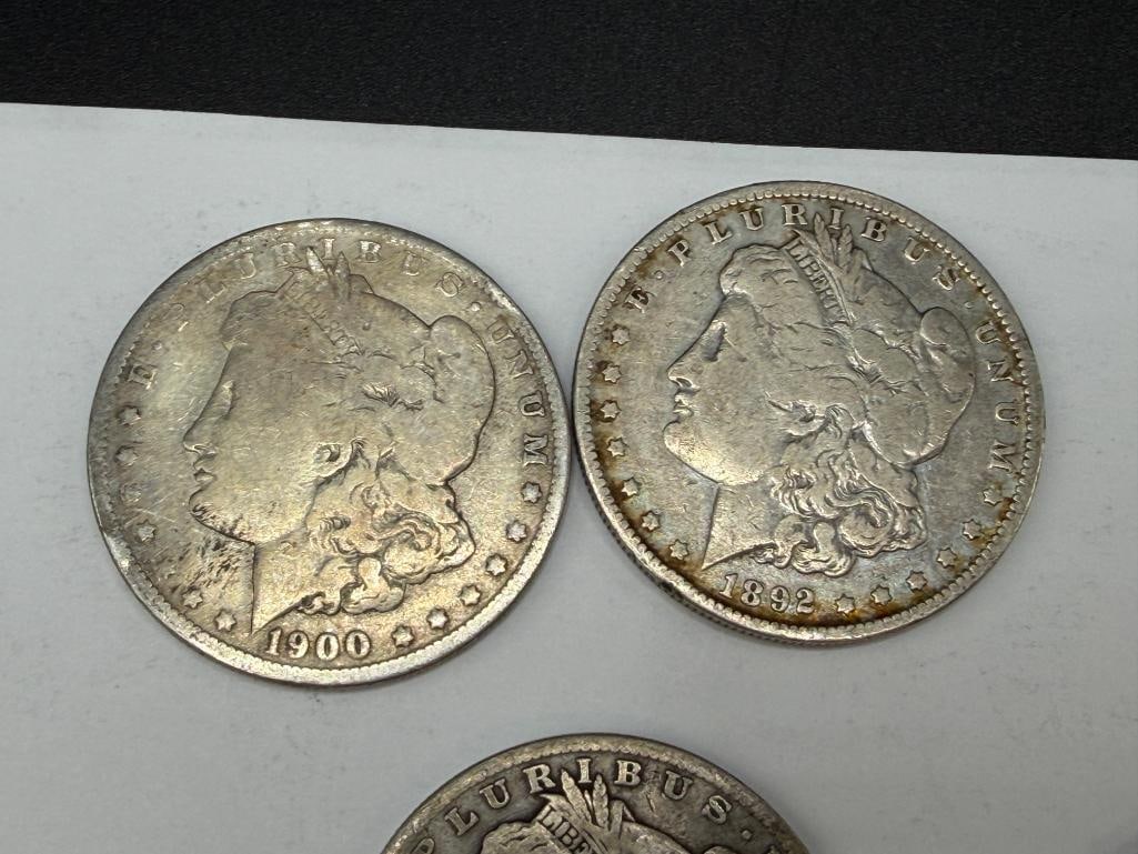 FIVE U.S. MORGAN SILVER DOLLARS FEATURING VARIOUS DATES AND MINT MARKS - 2