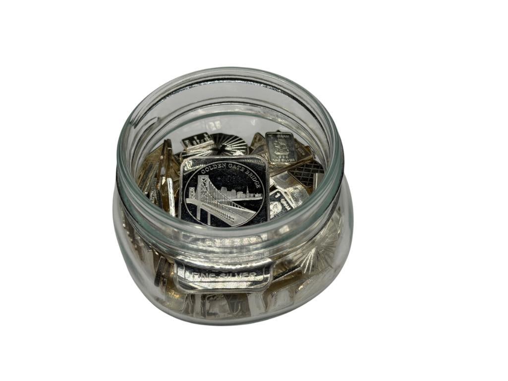 11.25 TROY OUNCES IN ASSORTED SILVER BARS AND ROUNDS: IN LIDDED GLASS JAR 11.25 TROY OUNCES