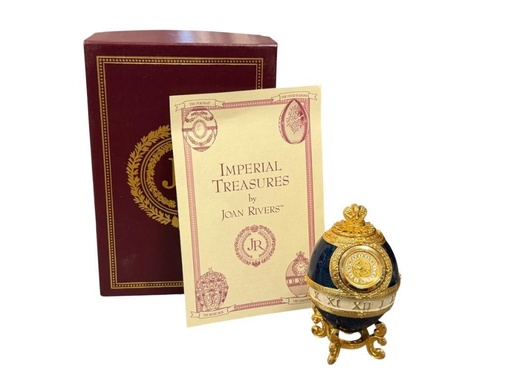 JOAN RIVERS IMPERIAL TREASURES THE TIME PIECE EGG: GOLD DECORATED AND ENAMELED EGG CLOCK WITH GOLD FINISHED FOUR FOOTED BASE, IN MINT CONDITION WITH CERTIFICATE AND ORIGINAL BOX 3 1/2" H