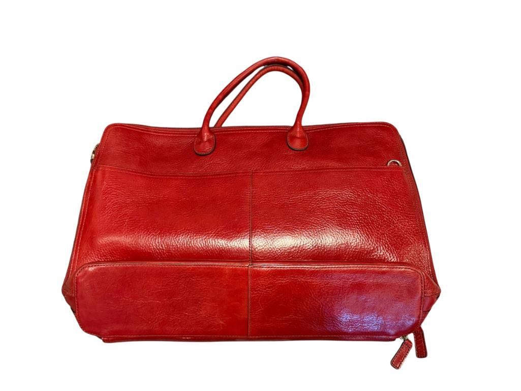 RED PEBBLED ITLALIAN BRIEFCASE LEATHER AND FOSSIL BLACK LEATHER BRIEFCASE: TWO DESIGNER LEATHER BRIEFCASE, FOSSIL BAG SHOWS MINOR WEAR ON THE BOTTOM, ITALIAN LEATHER BAG APPEARS LIKE-NEW BOTH APPROX. 16" X 10"