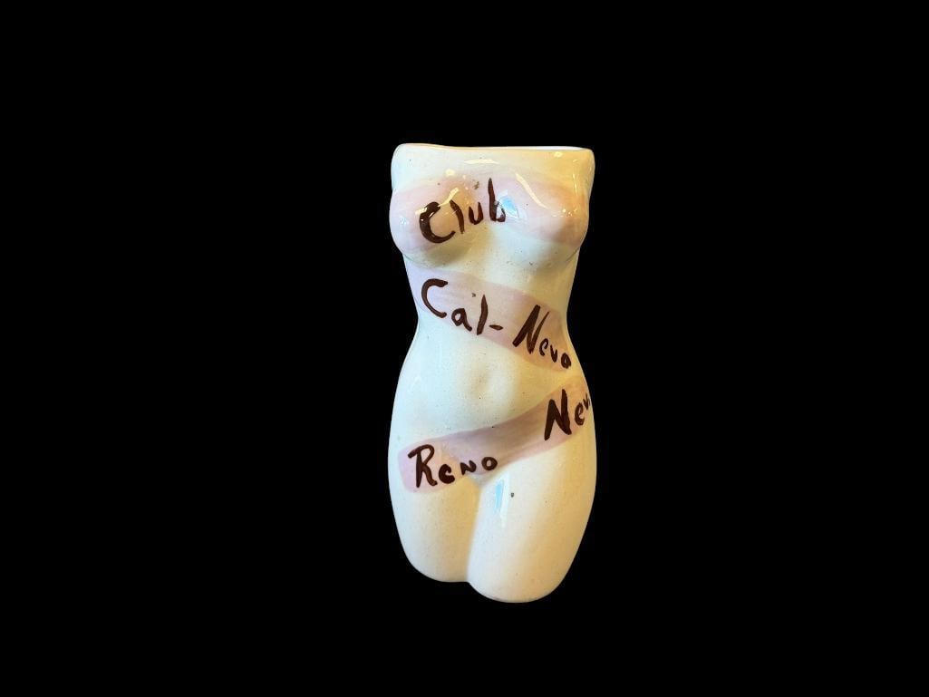 VINTAGE CLUB CAL-NEVA RENO, NV POTTERY NUDE TORSO CUP HAND PAINTED: FEMALE TORSO CERAMIC CUP WITH HAND PAINTED LETTERING, NO MARKINGS ON THE BOTTOM, SMALL HAIRLINE CRACK ON THE TOP EDGE, NO CHIPS 6" H