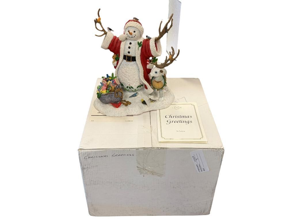 LENOX CHRISTMAS GREETINGS CENTERPIECE FIGURINE SNOWMAN COLLECTION BY LYNN BYWATERS: HAND PAINTED HOLIDAY FIGURINE OF SNOWMAN IN SANTAS ROBE WITH SACK OF TOYS AND LOG DEER, IN MINT CONDITION NO DAMAGE OR REPAIRS, INCLUDES ORIGINAL BOX AND CERTIFICATE 8 /2" H