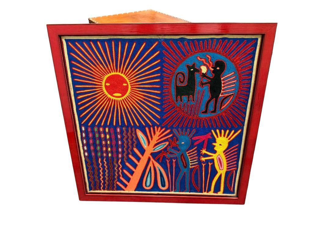 TRADITIONAL HUICHOL YARN PAINTING MADE BY INDIGENOUS WIXARIKA ARTISANS FROM MEXCIO: VIBRANT YARN PAINTING WITH FIGURES, PROMINENT SUN AND ANIMAL FIGURES WITH BLUE BACKGROUND, FRAMED 25 1/2" X 25 1/2" FRAME