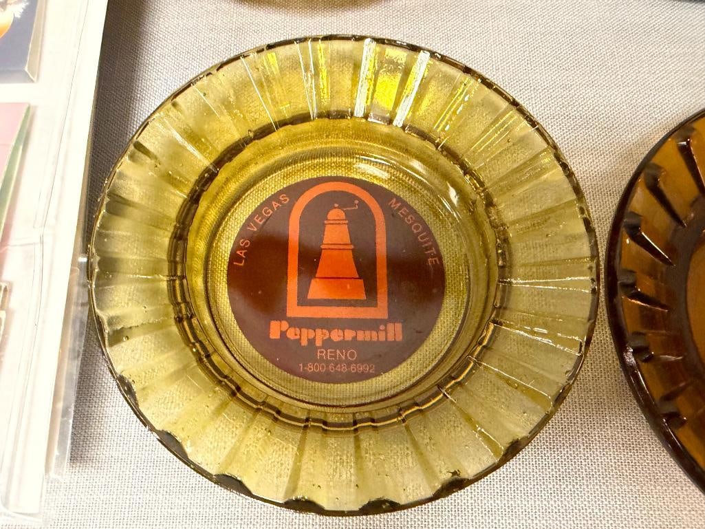 COLLECTION OF VINTAGE MATCHBOOKS AND GLASS ASHTRAYS - 12