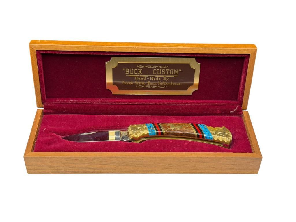 " BUCK - CUSTOM " FIXED BLADE KNIFE HAND MADE BY NAVAJO ARTIST DAVE YELLOWHORSE: FEATURING WOOD HANDLE INLAID WITH BRASS WITH HORSE DESIGN AS WELL AS ONYX, CORAL, AND CRUSHED TURQUOISE, CLIP-POINT BLADE, INCLUDES ORIGINAL WOODEN FELT LINED CASE 2 3/4" BLADE, 7 1/4" TOTAL LENGTH