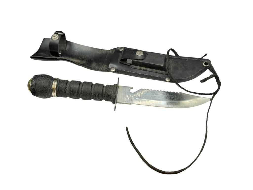 FIXED BLADE SURVIVALIST KNIFE WITH COMPASS AT BASE OF HANDLE, SHARPENING STONE, AND SUPPLIES: HANDLE HAS SEALED COMPARTMENT FOR MATCHES AND OTHER SURVIVAL ITEMS, INCLUDES BLACK FAUX LEATHER SHEATH 6" BLADE, 11 1/4" TOTAL LENGTH