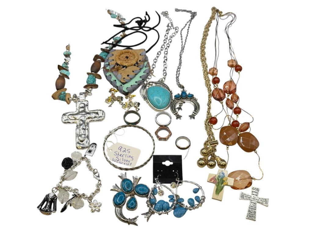 GREAT ASSORTMENT OF JEWELRY FEATURING SOUTHWEST DESIGNS AND A STERLING BANGLE BRACELET: INCLUDES TURQUOISE COLORED HOWLITE BEADS, STATEMENT NECKLACE, SILVER TONED RINGS, CHARM BRACELET, AND MORE