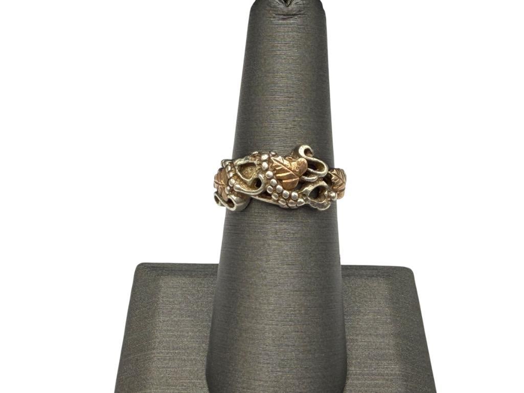 STERLING SILVER RING WITH ROSE GOLD LEAF ACCENTS: SIZE 6 3/4, 3/8" FRONT, 3.78 GRAMS