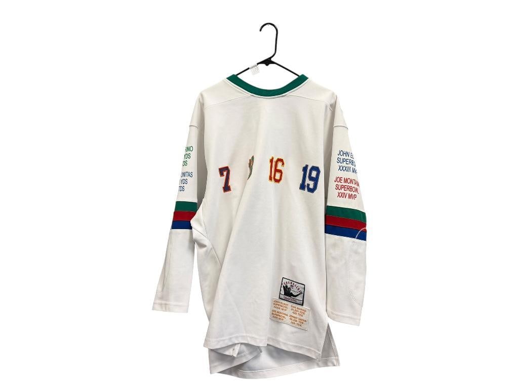 VINTAGE MITCHELL & NESS LIMITED EDITION EMBROIDERED AUTOGRAPHS JERSEY QUARTERBACKS OF THE CENTURY: FEATURES NUMBERS AND EMBROIDERED SIGNATURES OF STAR QUARTERBACK PLAYERS JOHN ELWAY, JOE MONTANA, DAN MARINO, AND JOHNNY UNITAS, NO. 598/2003, ORIGINAL LABELS