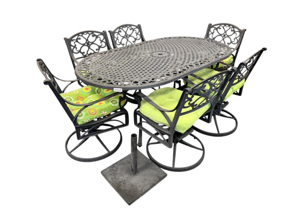 DECORATIVE CAST ALUMINUM PATIO / OUTDOOR DINING SET: OBLONG TABLE WITH WEAVE AND SCROLL DESIGN, INCLUDES SIX ARM CHAIRS WITH ROUND SWIVEL BASE, FINISH DOES SHOW FADING FROM WEATHER, INCLUDES MATCHING SEAT CUSHIONS AND SQUARE UMBRELLA STAND 72" X 41" TAB