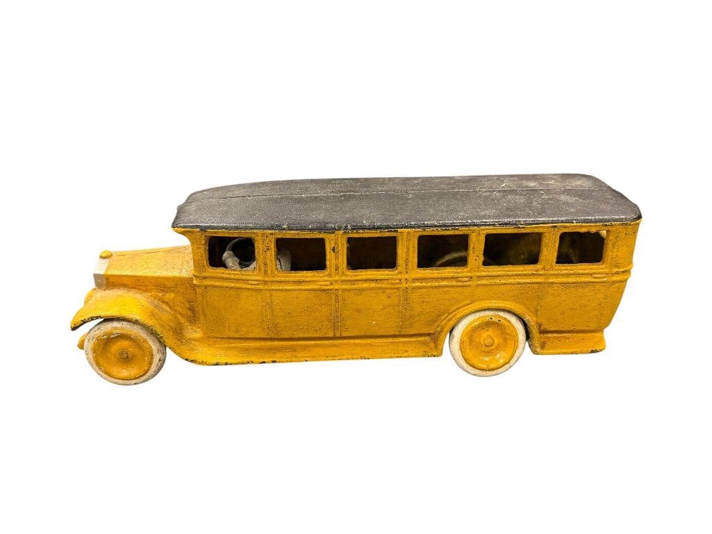 VINTAGE A.B. SKOGLUND & OLSON GEFLE SETO YELLOW CAST IRON SCHOOL BUS TOY CIRCA 1960'S - 70'S: REPRODUCTION, HEAVY CAST IRON WITH FIXED DRIVER, MARKED ON THE INSIDE OF THE BODY 10 1/2" L