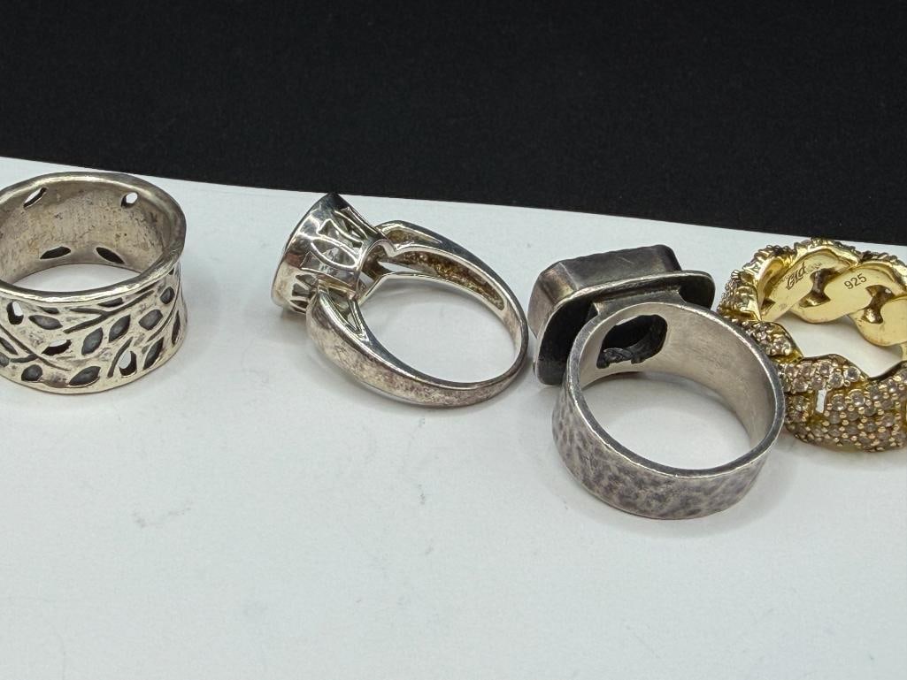 FIVE STERLING SILVER FASHION RINGS - 6