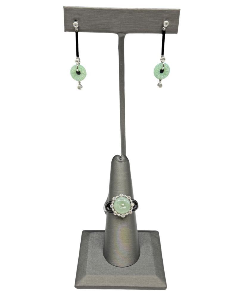 14K WHITE GOLD GREEN JADE, ONYX, AND DIAMOND FASHION RING AND MATCHING EARRINGS: EACH PIECE FEATURES A GREEN JADE DISC ACCENTED BY ONYX AND ROUND BRILLIANT CUT DIAMONDS, DANGLE DESIGN EARRINGS, DESIGNER HALLMARKED, EARRING BACKS ARE ALSO 14K GOLD RING IS SIZE 7 1/4, 5/8" FRONT,