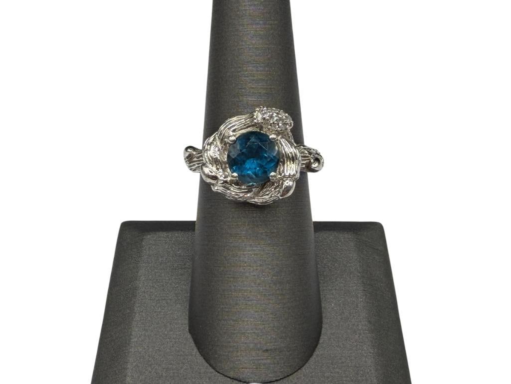 STEPHEN DWECK DESIGNER SIGNED STERLING SILVER BLUE ZIRCON AND DIAMOND RING: FEATURING BRANCH GARDEN NEST DESIGN WITH ROUND CUT ZIRCON IN CENTER, DESIGNER SIGNED, ACCENTED BY 10 ROUND BRILLIANT CUT DIAMONDS SIZE 7, 5/8" FRONT, 8MM ZIRCON, 10.23 GRAMS