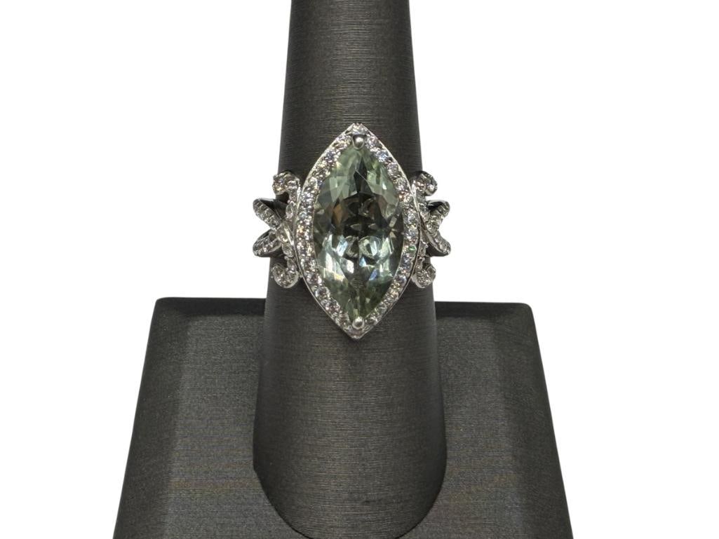 STERLING SILVER MARQUISE GREEN QUARTZ AND ROUND CUT CZ FASHION RING: FEATURING ELABORATE DESIGN OF ROUND CUT CZ'S SURROUNDING GREEN QUARTZ, DESIGNER HALLMARKED "XO-EC" SIZE 7 1/4, 17MM X 9MM QUARTZ, 1.5MM CZ'S, 1" FRONT, 6.67 GRAMS