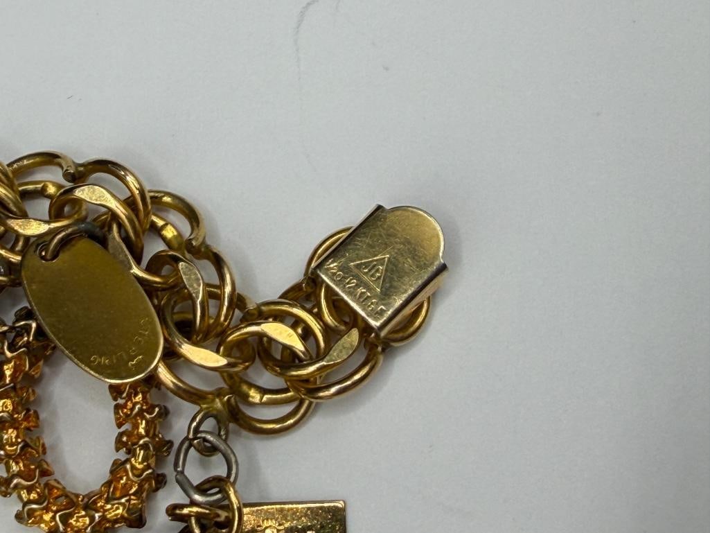 VINTAGE GOLD FILLED CHARM BRACELET FILLED WITH SEVERAL STERLING SILVER CHARMS AND TRAVELER THEME - 10