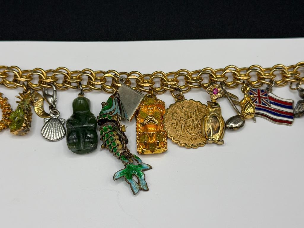 VINTAGE GOLD FILLED CHARM BRACELET FILLED WITH SEVERAL STERLING SILVER CHARMS AND TRAVELER THEME - 2