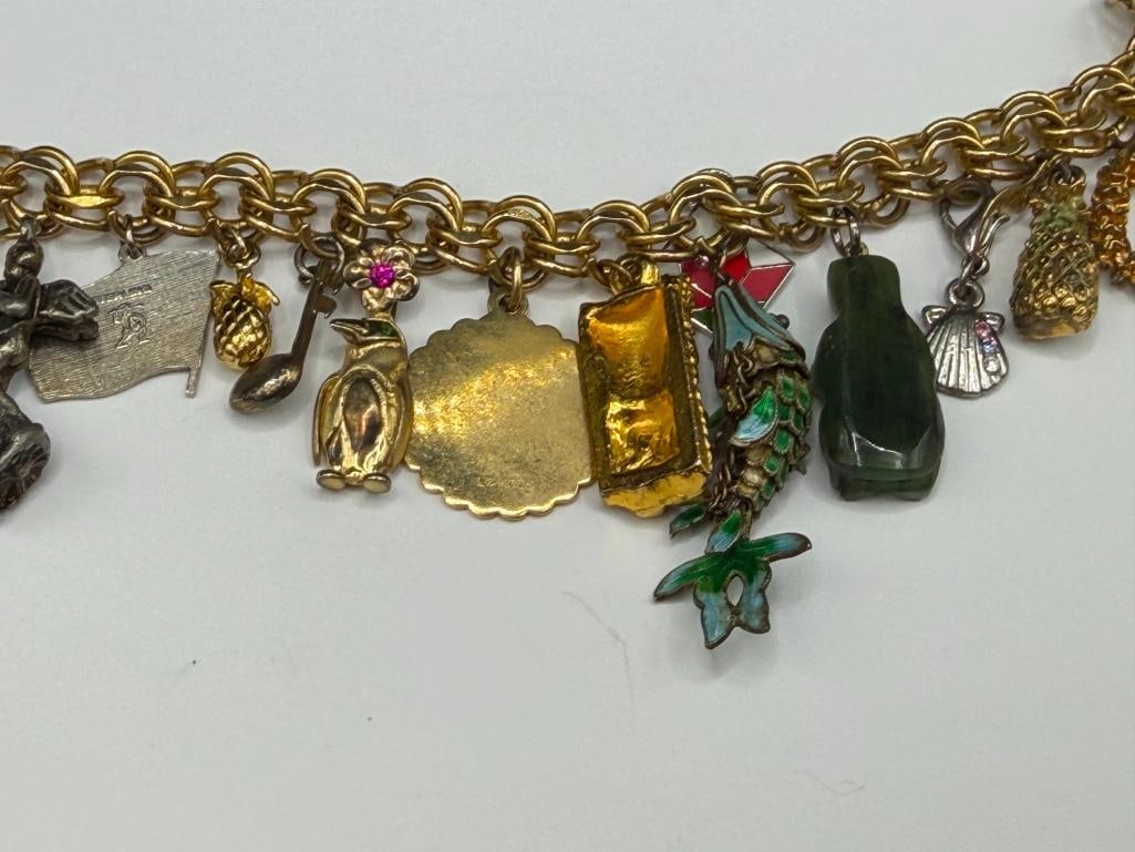 VINTAGE GOLD FILLED CHARM BRACELET FILLED WITH SEVERAL STERLING SILVER CHARMS AND TRAVELER THEME - 7