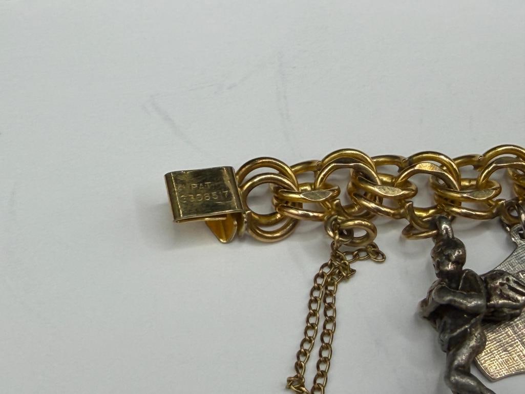 VINTAGE GOLD FILLED CHARM BRACELET FILLED WITH SEVERAL STERLING SILVER CHARMS AND TRAVELER THEME - 8