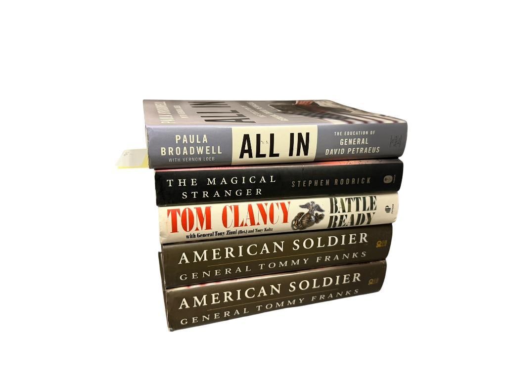 FIVE SIGNED HARDBACK BOOKS FROM AUTHORS TOM CLANCY, TOMMY FRANKS, STEPHEN RODRICK, AND MORE: INCLUDES "AMERICAN SOLDIER" BY GENERAL TOMMY FRANKS, "ALL IN" BY PAULA BROADWELL, "BATTLE READY" BY TOM CLANCY, AND "THE MAGICAL STRANGER" BY STEPHEN RODRICK, ALL WITH DUST COVERS AND IN GOOD