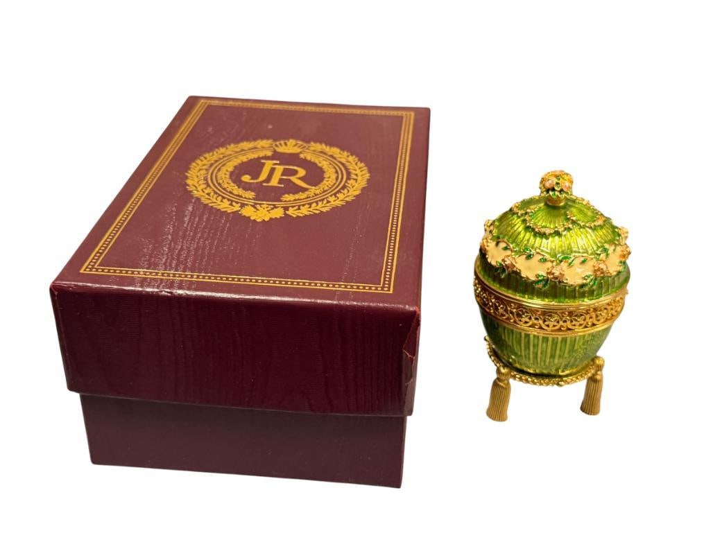 JOAN RIVERS IMPERIAL TREASURES III THE HIDDEN TIMEPIECE EGG DESIGNED IN THE STYLE OF LOUIS XVI: GREEN ENAMELED EGG WITH TIMEPIECE INSIDE, INTRICATELY DETAILED, IN NEAR MINT CONDITION WITH CERTIFICATE AND ORIGINAL BOX, NOT RUNNING MAY NEED A NEW BATTERY 3 1/2" H