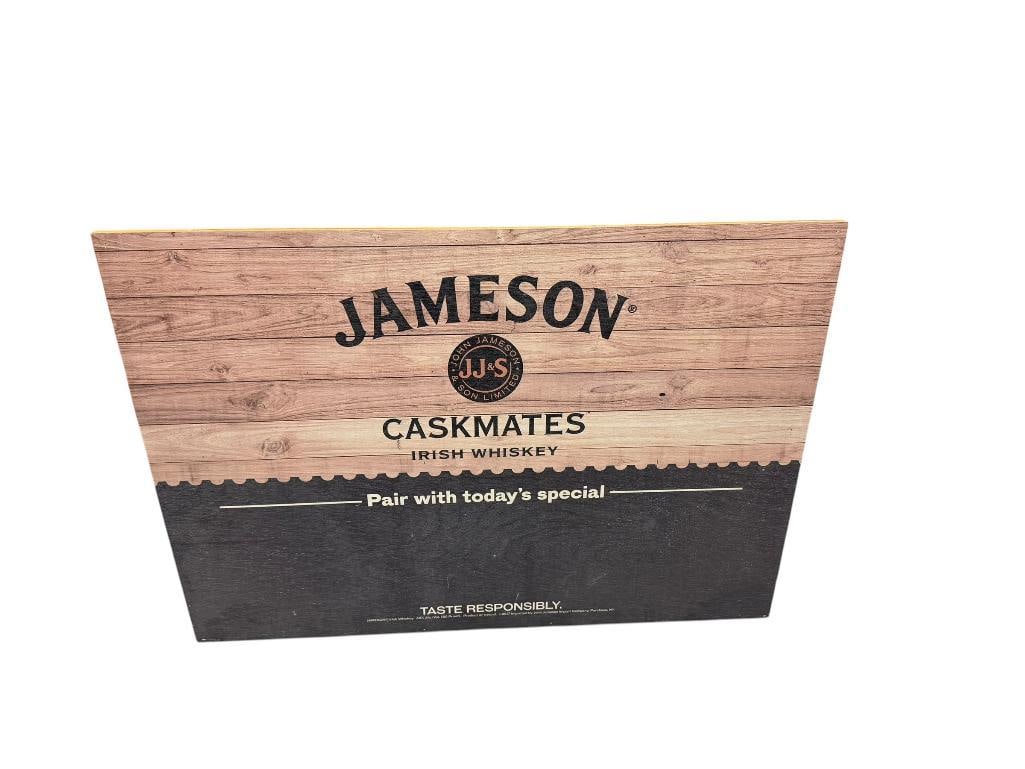 PAIR OF LIQUOR THEMED ADVERTISEMENT BAR SIGNS INCLUDING JAMESON IRISH WHISKEY AND JAGERMEISTER: ONE FEATURES PRESSED WOOD DESIGN AND OTHER IS TIN METAL LARGEST IS 28" X 20"