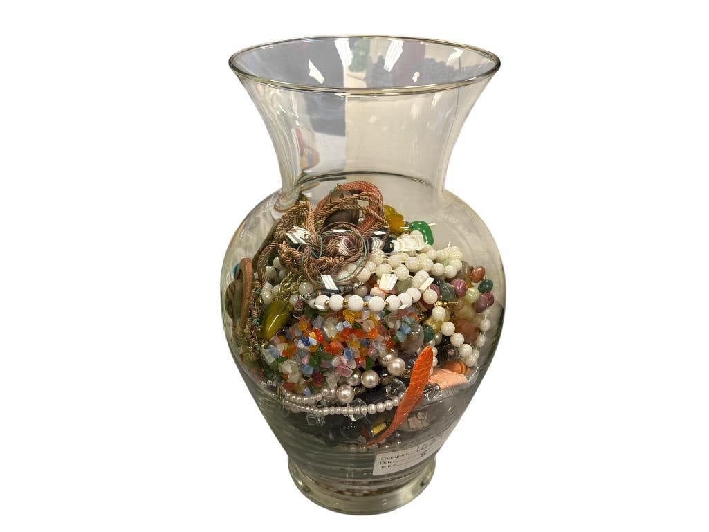 LARGE GLASS VASE 3/4 FULL OF WOMENS FASHION JEWELRY SOME WEARABLE SOME FOR ARTS & CRAFTS: 10 3/4" H