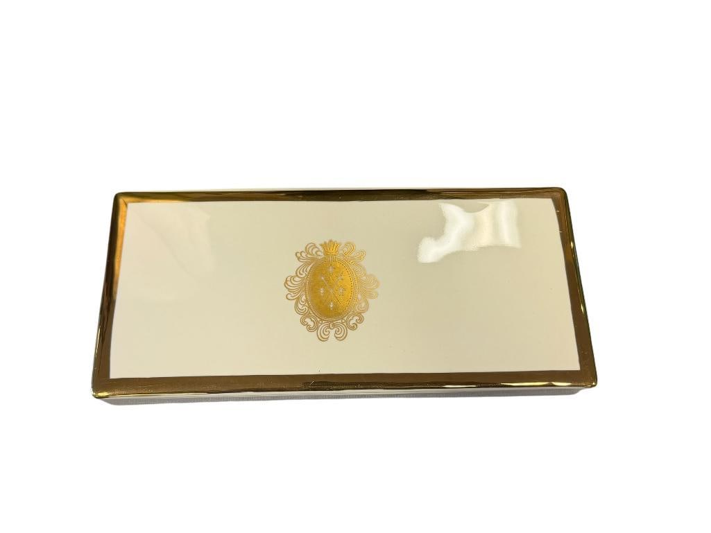 VINTAGE PORCELAIN LIDDED CIGARETTE BOX WITH GILT BORDER AND CREST IN THE CENTER: STYLIZED S MARK ON THE BOTTOM, NO CHIPS OR CRACKS 9" X 4"