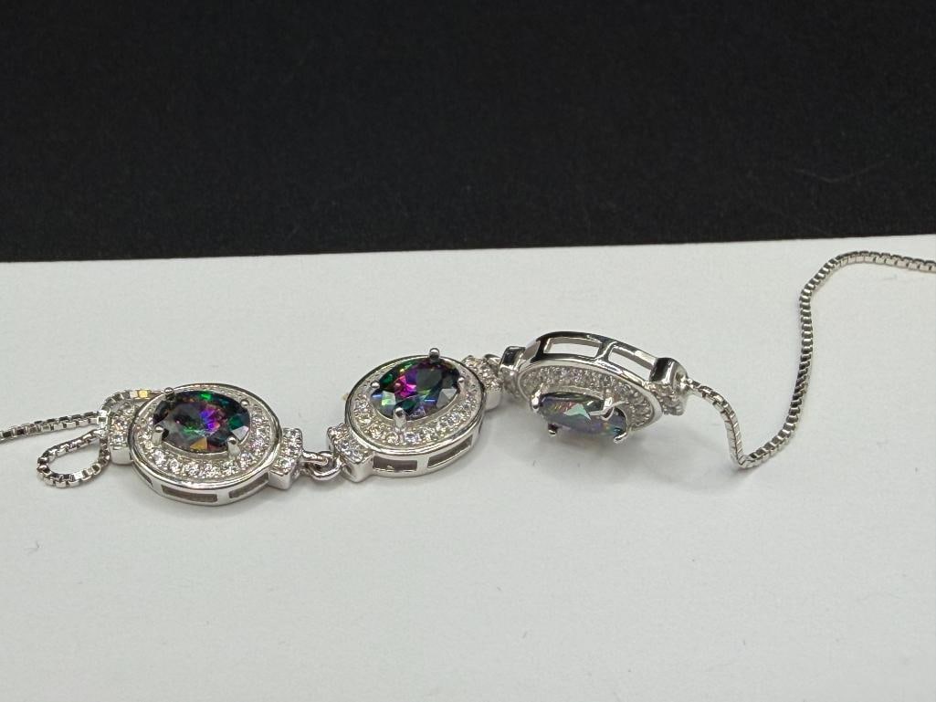 STERLING SILVER SIMULATED MYSTIC TOPAZ FASHION BRACELET FEATURING THREE OVAL CUT MYSTIC TOPAZ - 3