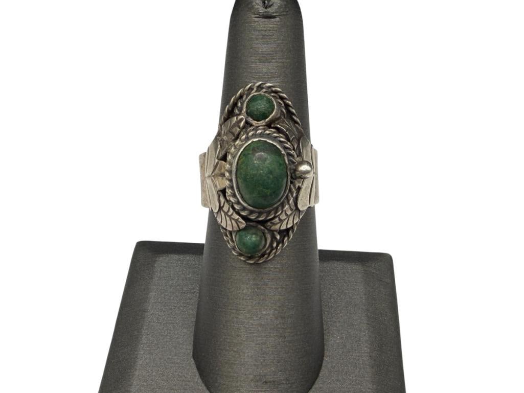 VINTAGE CBS TAXCO MEXICO SIGNED STERLING SILVER GREEN TURQUOISE POISON RING: ACCENTED WITH CABOCHON GREEN TURQUOISE AND FLORAL DESIGN, SIGNED BY MAKER ADJUSTABLE BAND, 1 1/4" FRONT, 11.86 GRAMS, 9MM X 7MM CENTER TURQUOISE