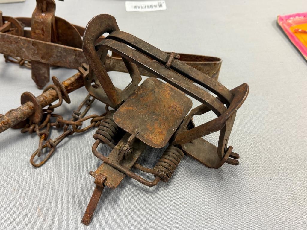 THREE ANTIQUE VICTOR ANIMAL HUNTING / GAME TRAPS ONE IS A COILED TRAP - 7