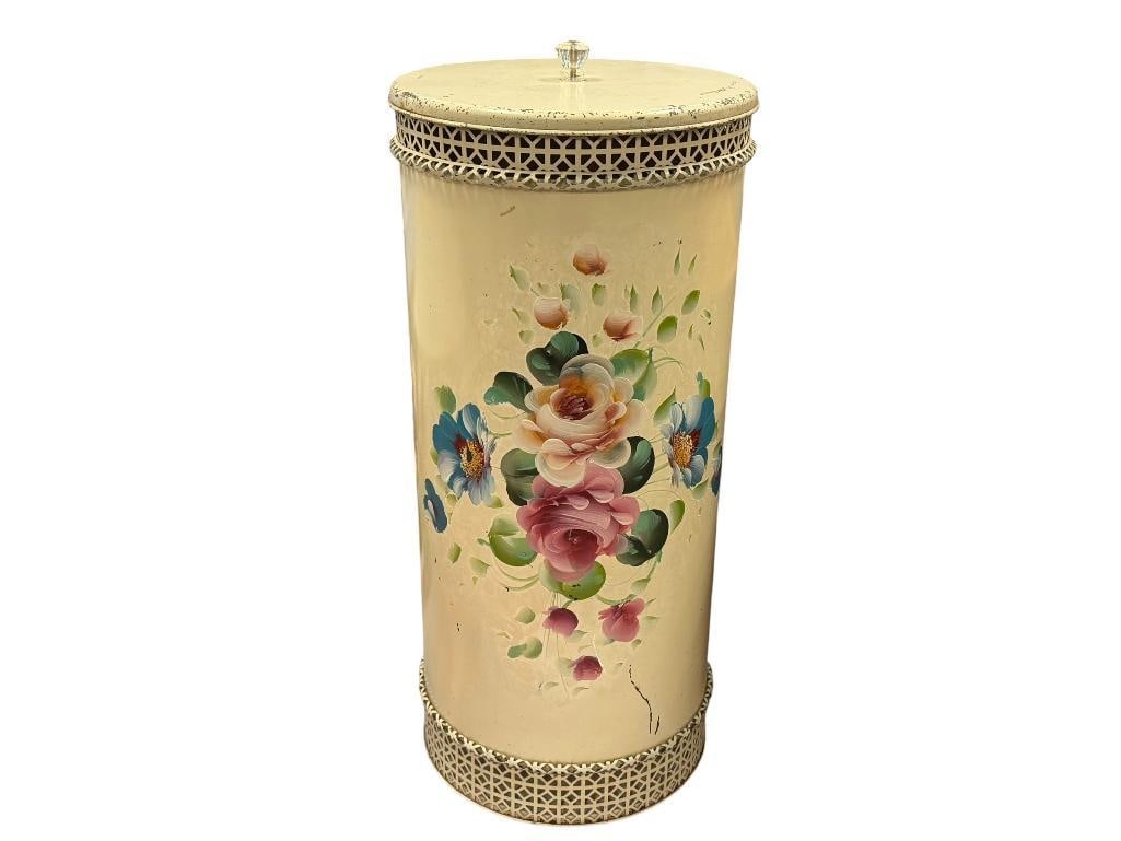 MID-CENTURY DEC-ART TOLE PAINTED METAL HAMPER WITH FLORAL DESIGN AND PIERCED RIM AND BASE: ROUND LID WITH GLASS KNOB HANDLE, MARKED ON THE INSIDE, ITEM DOES SHOW SOME WEAR AND SCRATCHES 22" H