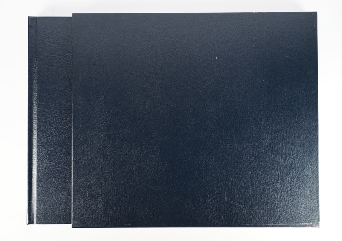 MOSS: A leatherbound dark blue covered - 'Stirling Moss Scrapbook 1961' - Signed by P.Porter (1 of 6)
