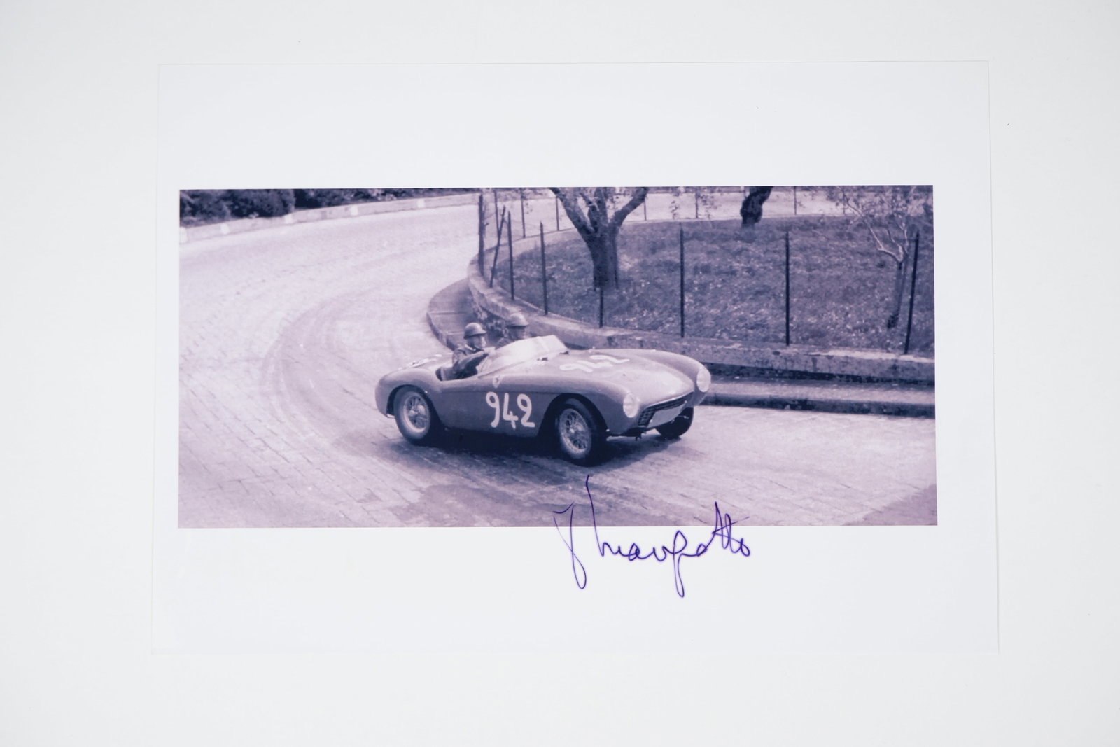 MARZOTTO: Image of P.Marzotto racing a Ferrari 500 Mondial at Verona, 1954. Image signed by Marzotto: MARZOTTO: A black and white image of Paolo Marzotto racing a Ferrari 500 Mondial at Verona, 1954, image signed by Marzotto; on photographic paper, image measures approximately 29.5cm wide, 21cm high o