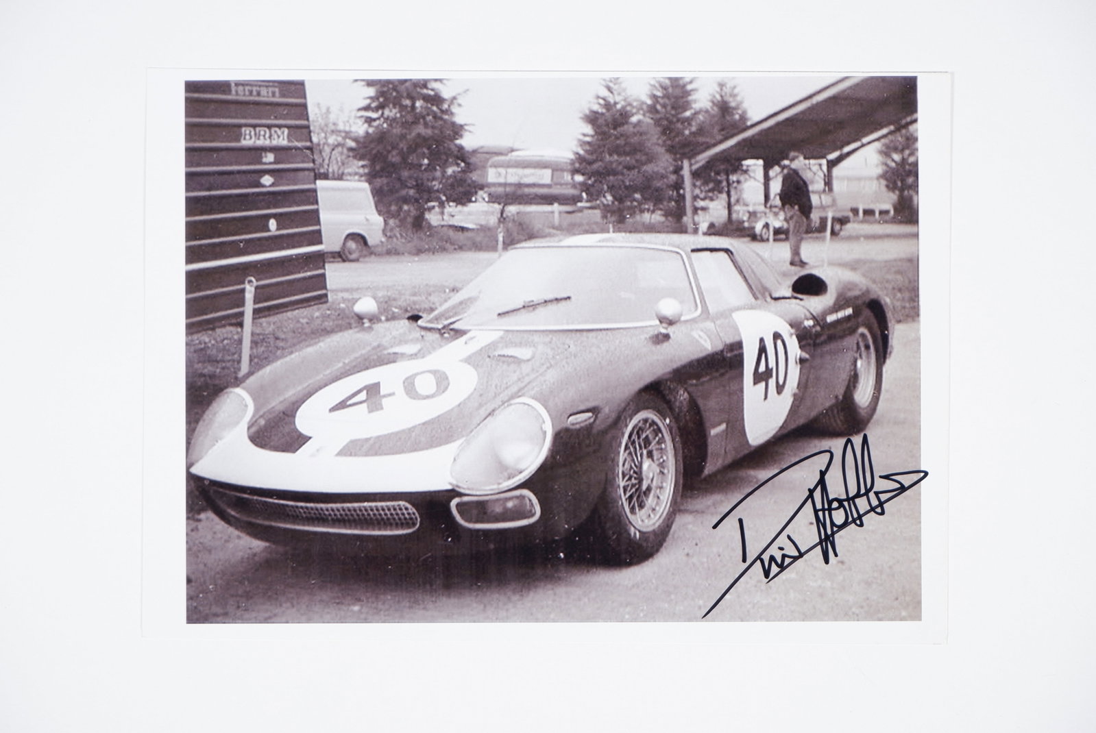 FERRARI/HOBBS: A black and white image of the #40 Ferrari 250 LM of David Hobbs. Hobbs signature: FERRARI/HOBBS: A black and white image of the #40 Ferrari 250 LM of David Hobbs, picture signed by Hobbs in black marker; on photographic paper, image measures 21cm wide, 15cm high overall.