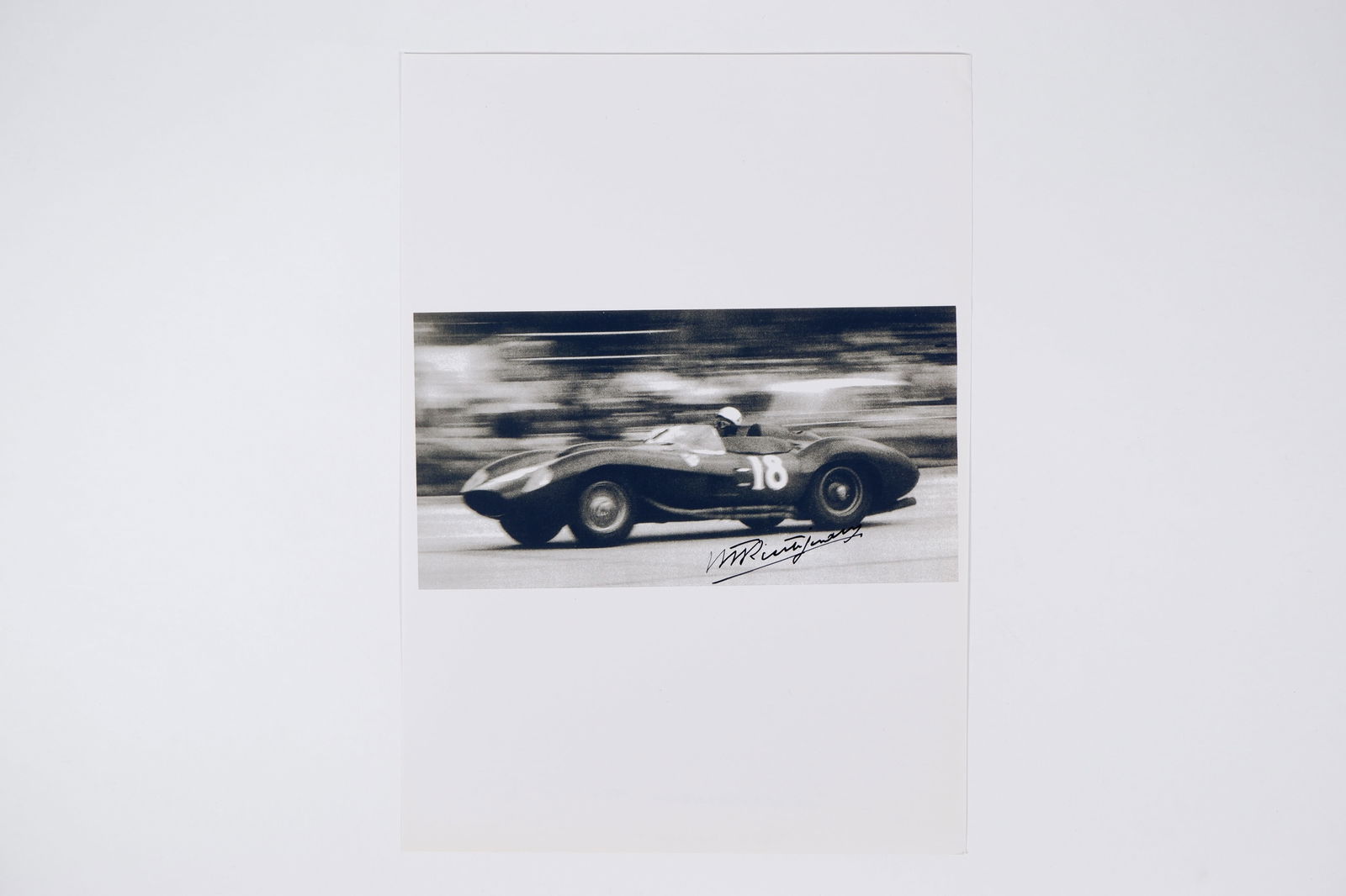 TRINTIGNANT: Image of Trintignant racing a Ferrari 335 S, 1957 Venezuelan G.P. Trintignant signature (1 of 1)