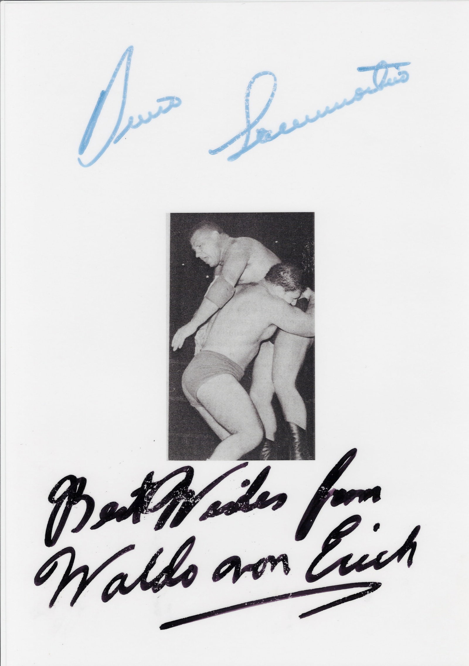 BRUNO SANTAMARIA & WALDO VON ERICH: An signed image of Bruno Santamaria & Waldo Von Erich: BRUNO SANTAMARIA & WALDO VON ERICH: An image of Bruno Santamaria & Waldo Von Erich (laminated), signed to margin in black marker by Bruno Santamaria & Waldo Von Erich, image measures 29.5 x 21cm overa