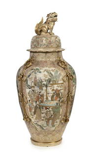 A substantial Japanese Satsuma baluster vase and cover, Meiji period: A substantial Japanese Satsuma baluster vase and cover, Meiji period the domed cover with large finial in the form of a crouching Buddhistic lion with scalloped border, painted with four cartouche pan