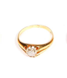 An antique solitaire diamond ring: An antique solitaire diamond ring, the old mine cut diamond claw set into the domed band, 18ct yellow gold, total weight 3.13gms