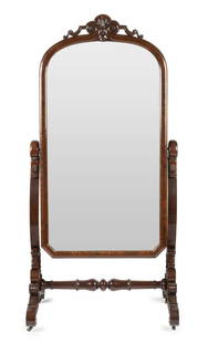 A Victorian mahogany cheval mirror: A Victorian mahogany cheval mirror