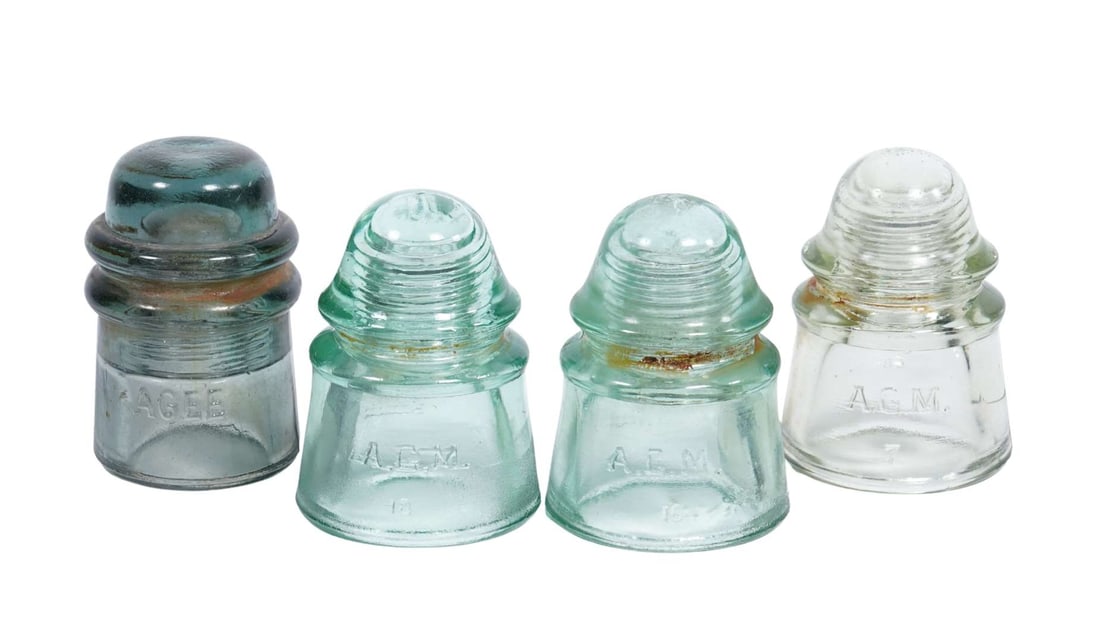 A set of four glass electrical insulators (1 of 2)