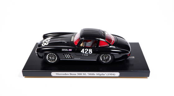MOSS: A Bburago 1/18 scale KIT Mercedes-Benz 300 SL 'Mille Miglia'. Bonnet signed by Stirling Moss: MOSS: A Bburago 1/18 scale KIT Mercedes-Benz 300 SL 'Mille Miglia', 1954, bonnet signed by Stirling Moss, black, racing number '428', grey seats, opening features, steerable wheels, constructed, mount