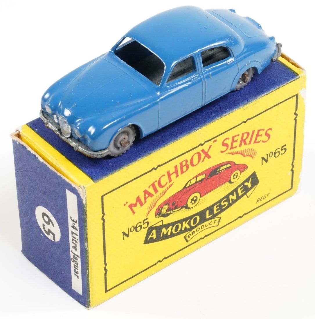 JAGUAR: A 1960s Matchbox MB 65 3.4 LITRE JAGUAR: JAGUAR: A 1960s Matchbox MB 65 3.4 LITRE JAGUAR, blue, grey plastic wheels, black base, tow hook, crimped axles; original 'B5' Type box is very good - paper loss to one picture side.