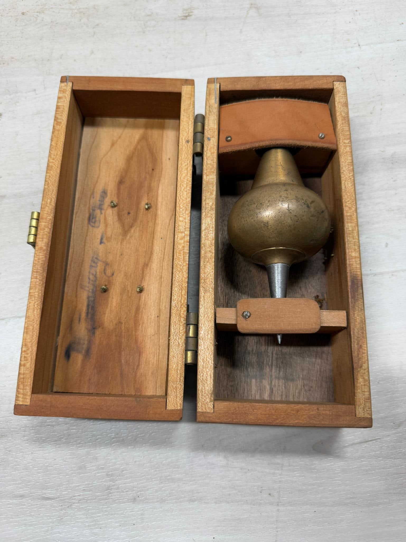 Inverted onion plumb bob in wooden storage box (1 of 2)